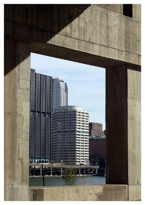 Another shot of city framed by bridge abuttments