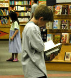 Heres a reader who can stand and read TWO books!