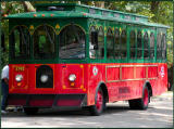 Mr. Rogers Trolley takes people to the race.