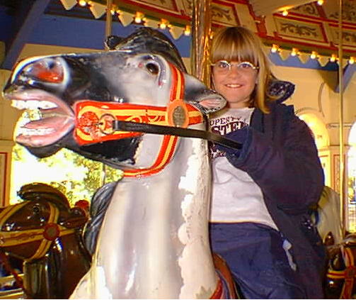 Miss Sydney, my nicest niece riding the merry-go-round at King's Island.