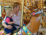 Kaelyn rides<BR>a reindeer with granma