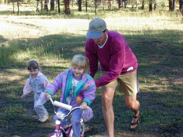 Uncle Kelly helps Caitlin<BR>get going on her 2-Wheeler