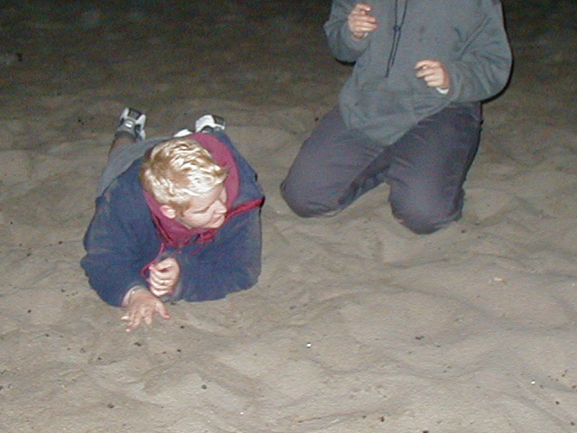 SarahJane & Jen wrestle in the sand!
