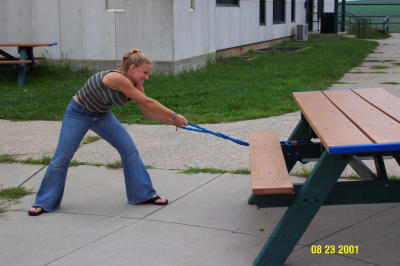 Britt Stealing our Picnic Table.JPG