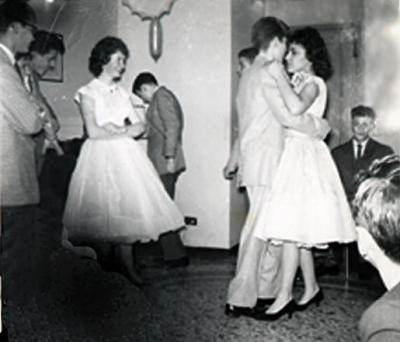 Mickey is dancing with Michael Holly, his sister Margie is to the left.