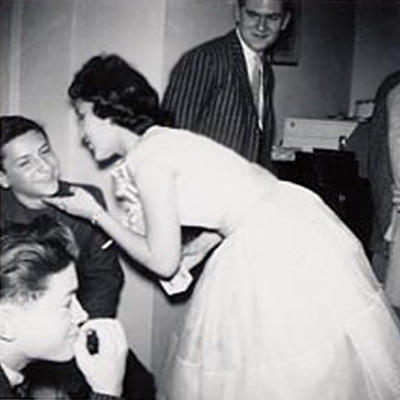 Mickey kisses Bobby Barto DIll, and that's Eddie Ballard (deceased) smiling behind her.