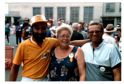 Clyde Gibbs, Mrs. Carmen Acosta, Bill Chapman with 1984 reunion pin
