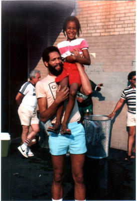 Mike lived in the last house on 61st Street. I believe that is his child on his shoulder. 
