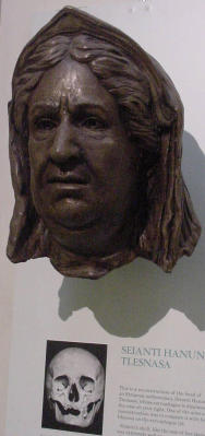 The bronze face is on the wall adjacent to the sarcophagus. Scientists analyzed her skull and believe this is what she looked like upon her death. They calculated that she would have been about 50 years old.
