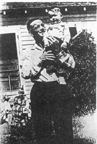 Arthur Thomas holding John Morris Houston