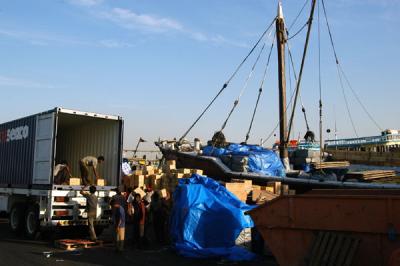 Unloading a container onto a dhow
