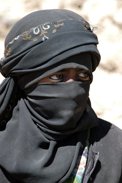 Veiled girl in Al-Hajjarah, Yemen