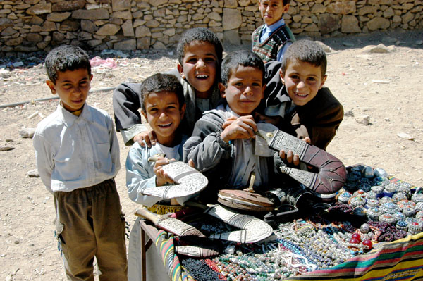 Kids manning a souvenir table, Al-Hajjarah