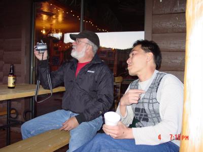 Dien watches Ed check camera