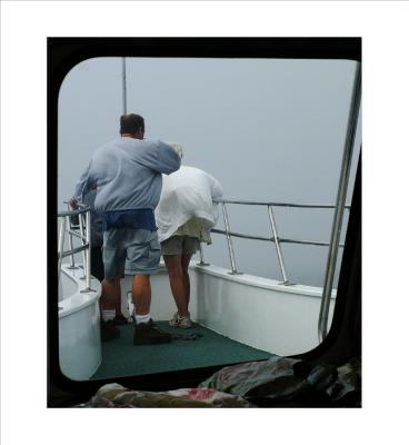 Passengers stand on the bow for the trip home.