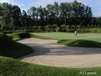 13th green with water all along right side...