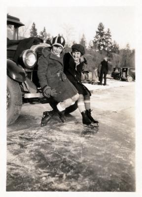 Mom ice skating with Marnie (Mary Margeurite Adams).  Wade Adams near campfire in background, 1930 (303)
