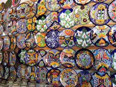 A wall of plates for sale in one of the shops