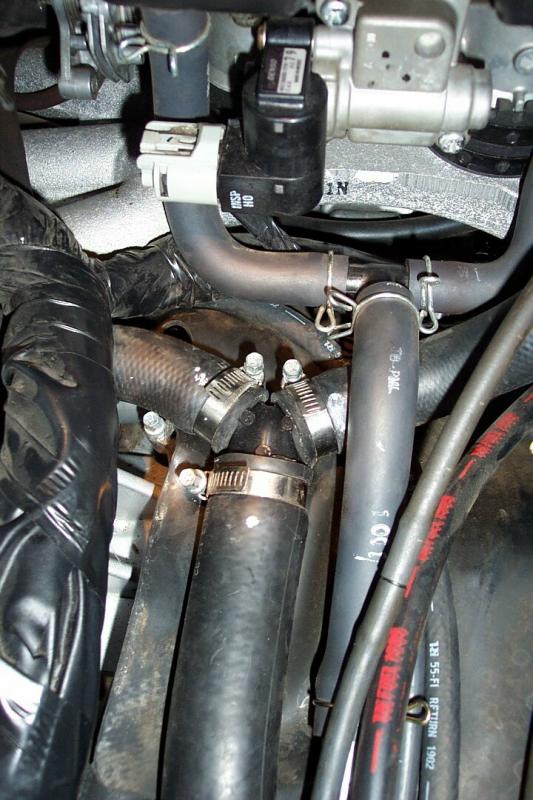 I turned the hose clamps. Cover them with hard rubber material to prevent them from rubbing a hole in the bottom of the gas tank