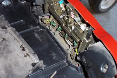 Then remove the cover for the latch assy inside the trunk