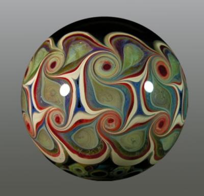 Murrine 'G' is surrounded by multiple milli in this marble. Pinwheels adorn the sides.