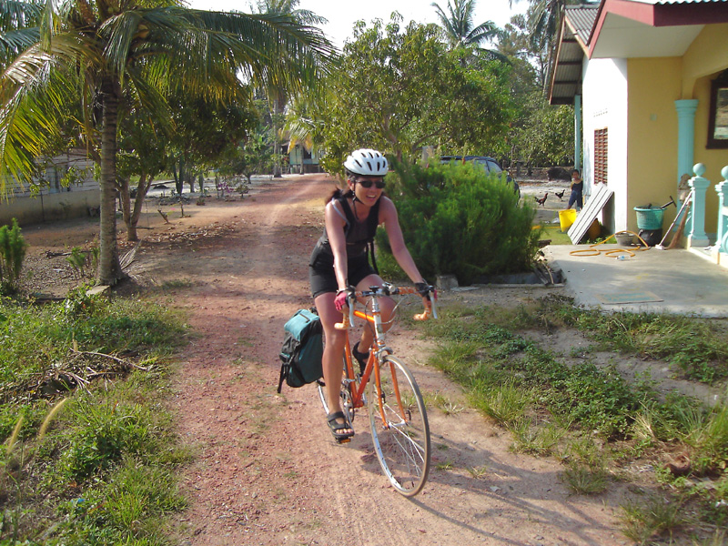 Lady Su cycling carefully - trying to avoid making another depression on the track again