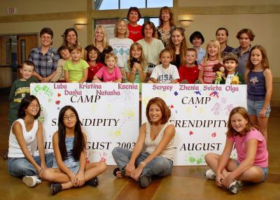 Camp volunteers say  goodbye (прощание) to the orphans