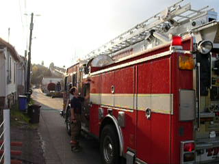 Engine 13 arrives on scene.  Canceles other in coming units from the original first alarm that went out.
