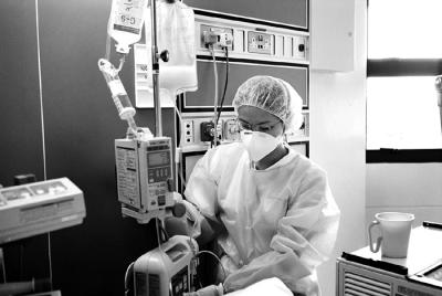 ICU Nurse Setting IV Pump