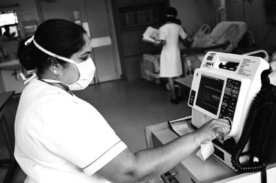 Cardiology Nurse Checking AED Machine