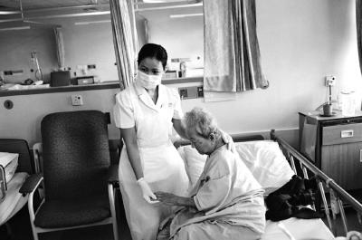 Nurse Comforting Elderly Patient