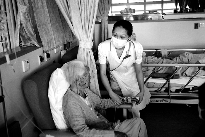 Nurse Adjusting IV Drip