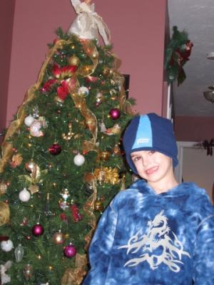 Liam posing by the tree