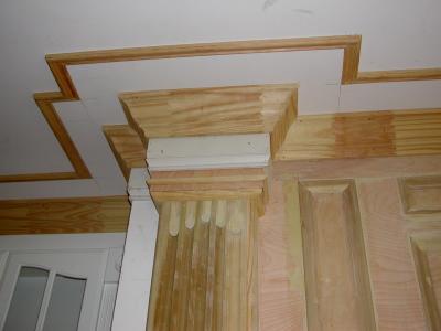 The cornice trim follows the mantle lines