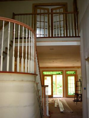 Stairs lead to upstairs media room with French doors
