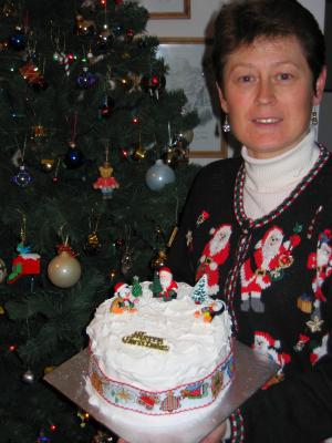 The 2004 cake just before Pete digs in. The penguin fell over before the icing dried, must have been all the sherry in the cake!