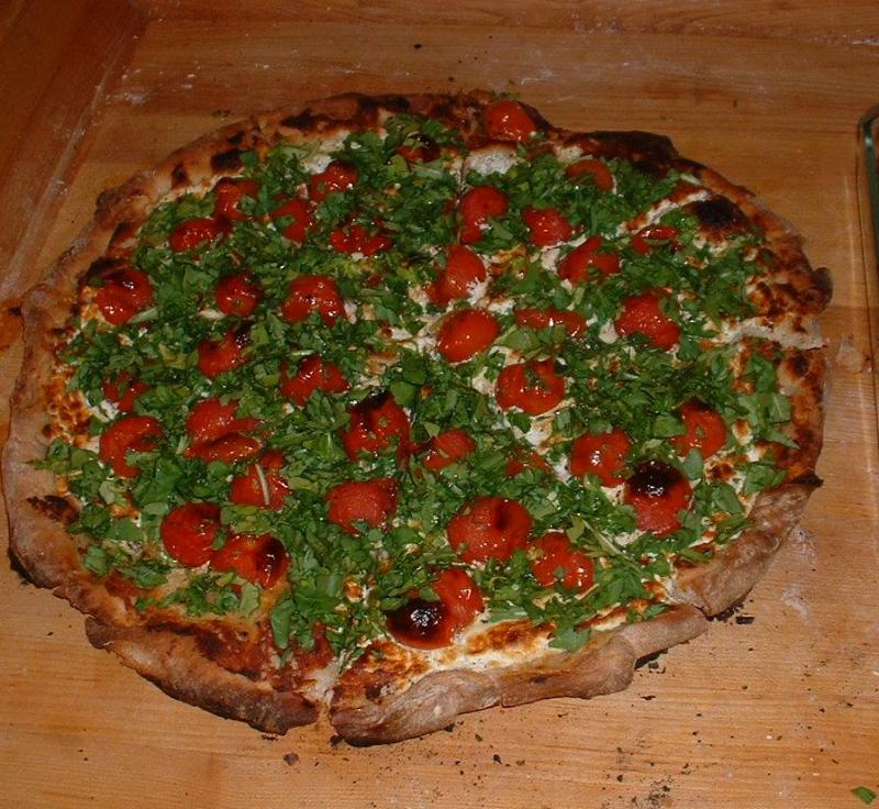 Goat Cheese Pizza with Cherry Tomatoes and Arugula