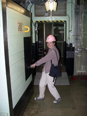 Lisa showing her strength by closing a 12 inch thick blast door. The helmet is not a fashion statement - It's regulations Mam!