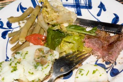 steak, garlic mint beans, garlic potato salad, mesclun and tomato salad