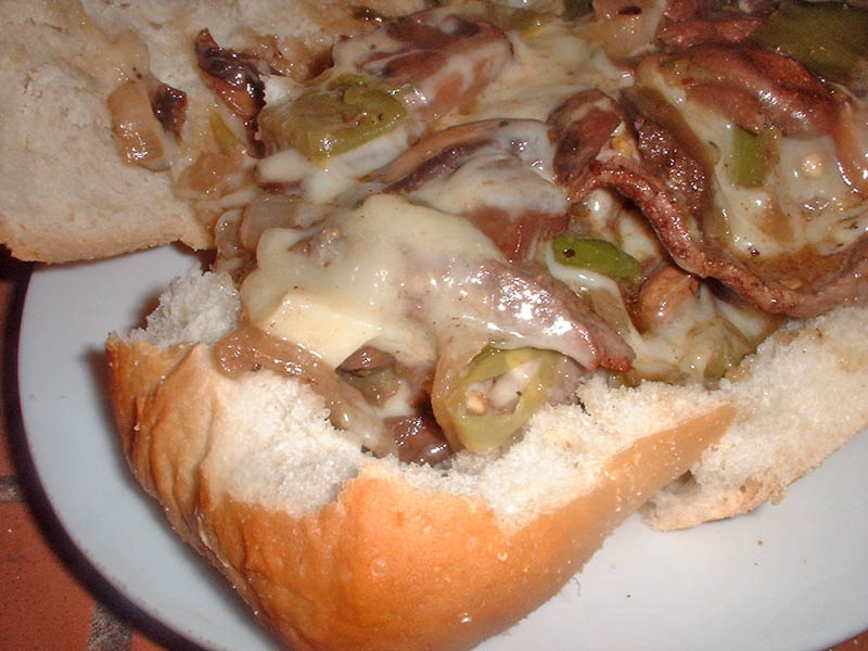 mushroom onion pepper cheesesteak sandwich