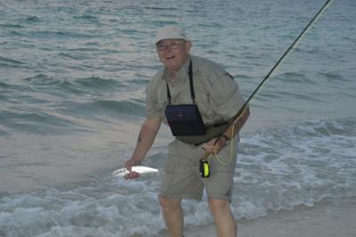 John catches a bonefish in front of the lodge at dawn!