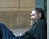 One of the homeless men with little to do but watch the world go by