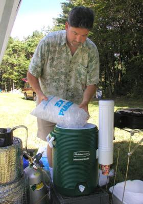 Rick preps  a beer keg cooler with ice