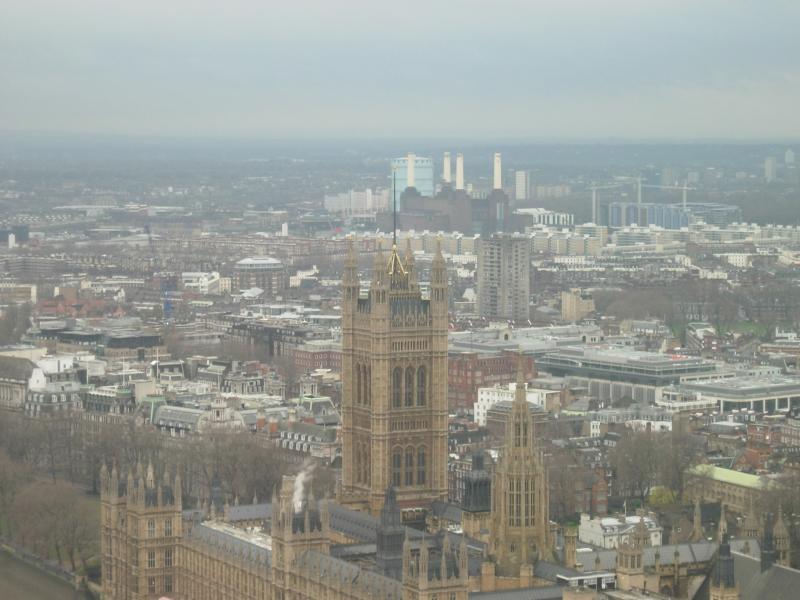 The houses of Parliament, with the four towers of Battersea Power Station in the background.