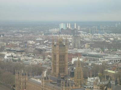 The houses of Parliament, with the four towers of Battersea Power Station in the background.