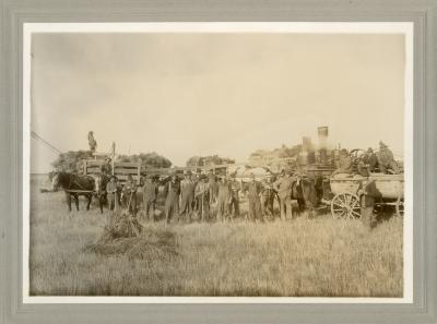 One of Chris Larsen's Threshing Crews
Chris is sitting in the wagon at far right.