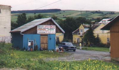 A small shop with a picturesque view in the background.