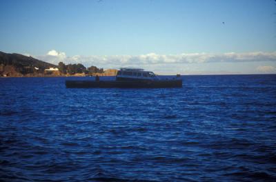 Van crossing Lake Titicaca narrow