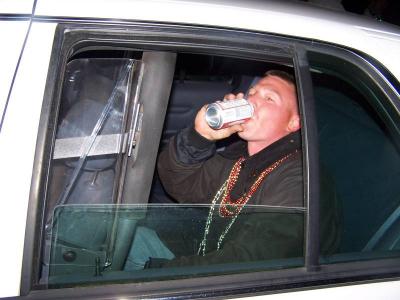 Jason in the back of a cop car