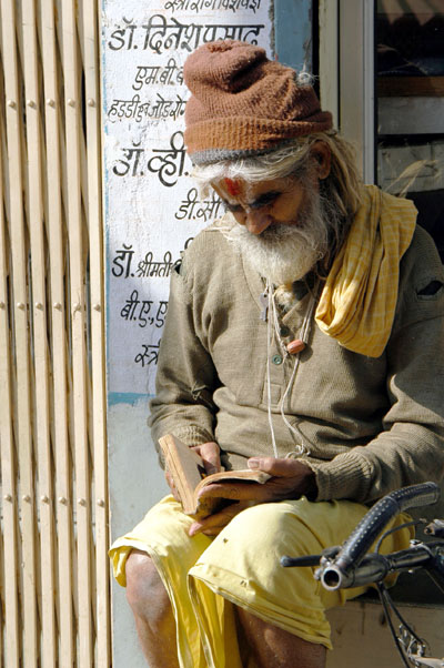 Old man reading a book, Gwalior, India